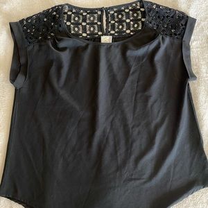 Black short sleeve crocheted shoulder blouse.